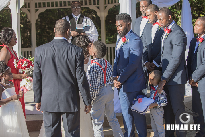 son kissing bride